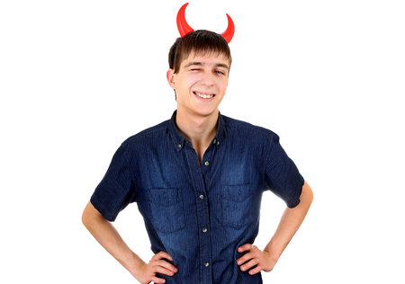 Cheerful Young Man with Devil Horns Isolated on the White Backgroundの写真素材