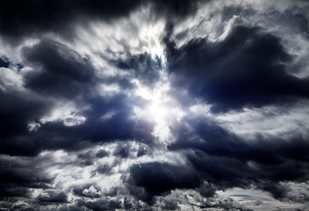 Light in the Dark and Dramatic Storm Cloudsの写真素材