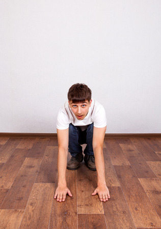 Young Man on the Floor in the Roomの写真素材