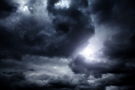 Light in the Dark and Dramatic Storm Cloudsの写真素材