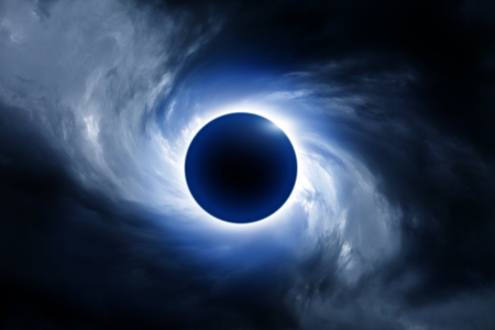 Blurred Black Hole in the Swirl of the Dark Storm Cloudsの写真素材