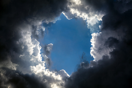 Hole in the Dark and Dramatic Storm Cloudsの写真素材