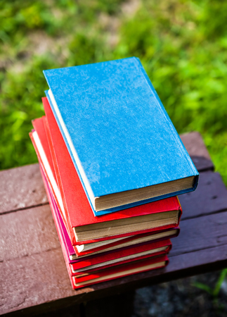 Pile of the Old Books on the Bench closeupの写真素材