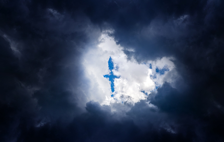 Cross Shape in the Dark Storm Cloudsの写真素材