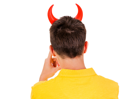 Rear View of a Man with Devil Horns on the White Backgroundの写真素材