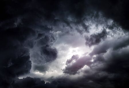 Light in the Dark and Dramatic Storm Cloudsの写真素材