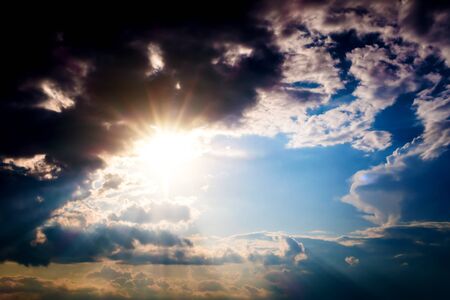 Dramatic Cloudscape Background with Sun and Blue Sky