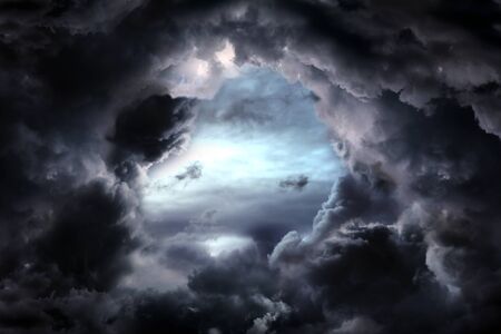Hole in the Dark and Dramatic Storm Clouds