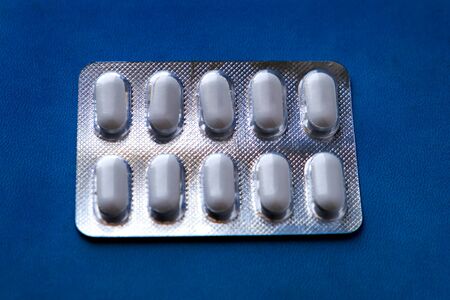 Pills Pack on the Blue Background closeup