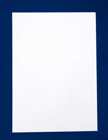 Blank Paper on the Blue Fabric Background closeupの写真素材