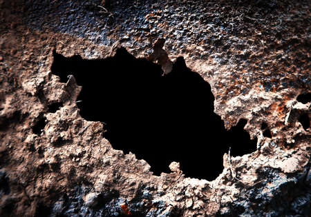 Hole in the Rusty Metal closeupの写真素材