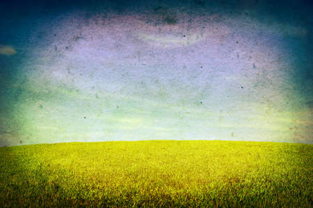Old and Dirty Photo with Summer Field and Blue Skyの写真素材