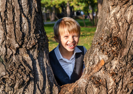 Happy Kid playing in the Summer Park