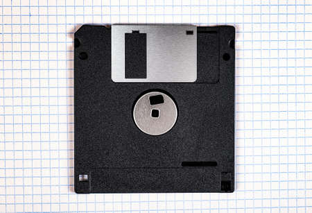 Floppy Disk Drive on the Square Paper Background closeupの写真素材