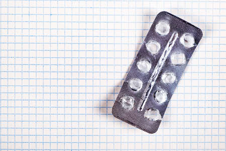 Empty Pack of the Pills on the Paper Background closeup