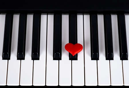 Piano Keyboard with a Red Heart closeupの写真素材