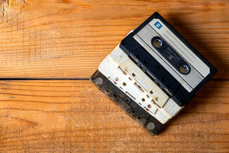 Old Audio Cassettes on a Wooden Planks Background closeupの写真素材