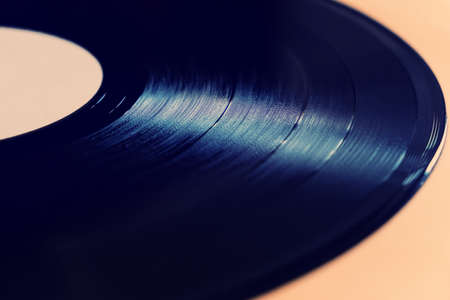 Toned Photo of Old Vinyl Record on the Table closeupの写真素材