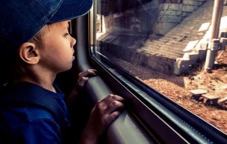 Kid in the Train by the Window