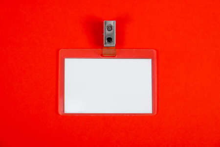 Blank Badge on the Red Paper Background closeupの写真素材