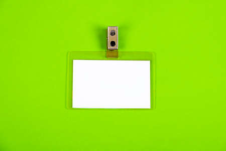 Blank Badge on the Green Paper Background closeupの写真素材
