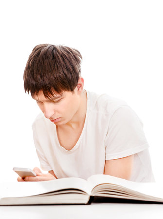 Student with a Book use a Smart Phone Isolated on the White Backgroundの写真素材