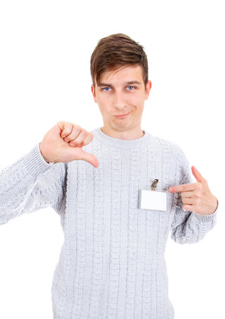Displeased Young Man with the Empty Badge show Thumb Down Gesture on the White Backgroundの写真素材