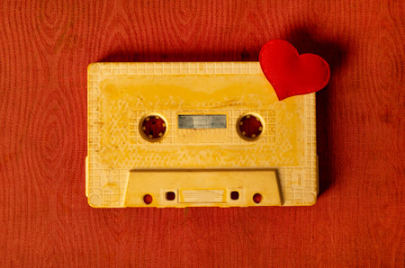 Toned Photo of the Old Audio Tape Cassette with a Red Heartの写真素材