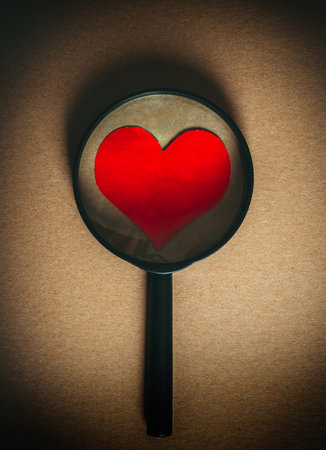 Vignetting Photo of Heart Shape in the Magnifying Glassの写真素材