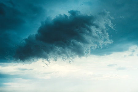 Toned Photo of Dramatic Rain Clouds Background in the Stormy Weatherの写真素材