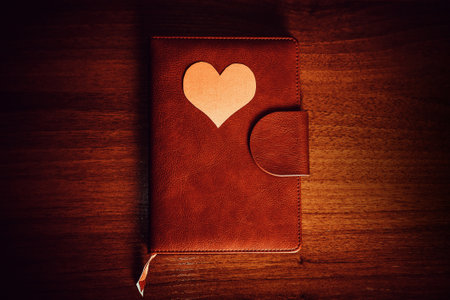 Vignetting Photo of Red Heart Shape on the Book closeupの写真素材