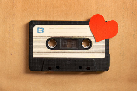 Old Audio Tape Cassette with a Red Heart on the Paper closeupの写真素材