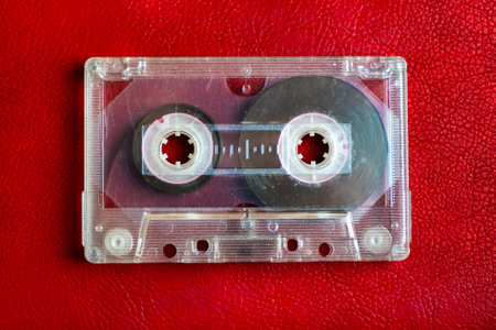 Old Audio Cassette on the Red Background closeupの写真素材