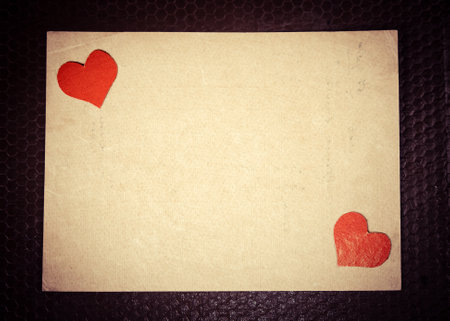 Red Hearts on the Old Paper Background closeupの写真素材