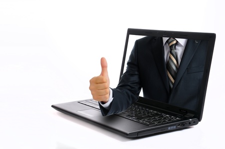 Successful business man holding his thumbs up onlineの写真素材