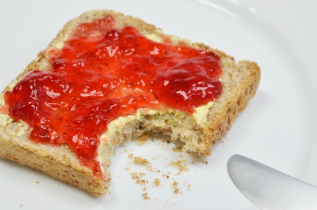 Strawberry jam on Toast, missing Bite with Crumbsの写真素材