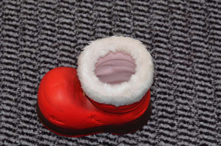 santa red boot, empty, close up on gray backgroundの写真素材
