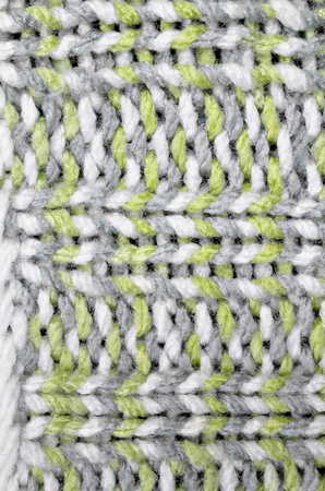 Knitted background pattern, white, light green and gray, close up, macro, full frame, directly above, verticalnkledの写真素材