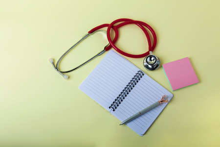 Medical face mask, stethoscope. Top view, covid - 19 protection concept. Medical equipment composition.の写真素材