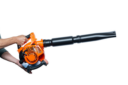 Close up hands holding Air Blower Tool or Leaf Blower isolated on white. Worker with a leaf blower. Leaf blower. Gardening. Handheld Blowing leaves away. Tools. Gardening. Machine. Studio shotの写真素材