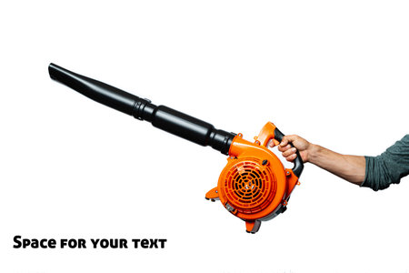 A man holding Engine pull cord a Air Blower Tool in one hand. Starting a handheld leaf blower, cordless, electric leaf blower isolated on white background. Garden and lawn care concept. Studio shotの写真素材