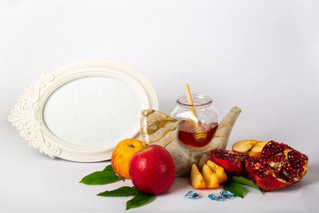 Rosh Hashanah concept with traditional Jewish New Year symbols and greeting Shana Tova, Hebrew text meaning Happy New Year. Festive holiday composition representing Jewish cultureの写真素材
