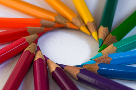 Many different colored pencils put in a circle on a white background. Colored pencils rainbow.の写真素材