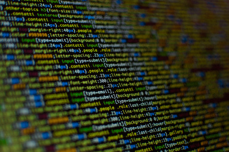 Software development. Software source code. Programming code. Writing code programming on laptop.の写真素材