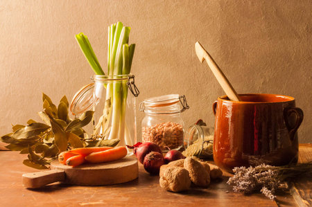 Still Life "Vegetable Soup", with carrots, leeks, potatoes, lavender, bay, beans and riceの写真素材
