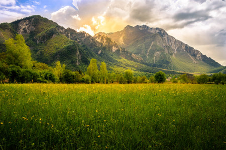 Spring landscape from meadows in Venzone, Italy, with beautiful mountains in the background.の写真素材