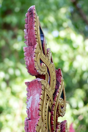 Texture of naga tail Stucco red gold green backgroundの写真素材