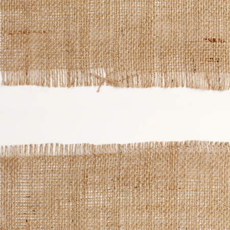 texture of Burlap hessian square with frayed edges on white background white spaceの写真素材