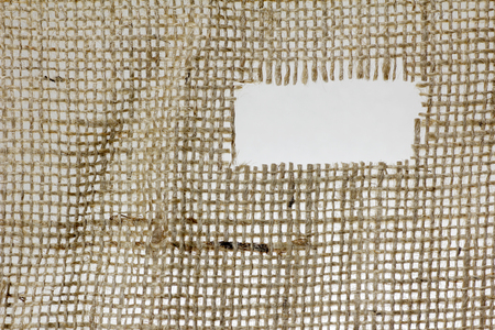 texture of Burlap hessian hole with frayed edges on white backgroundの写真素材