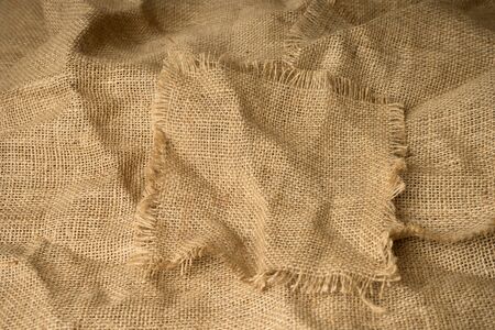 texture of burlap material background hessian with frayed edges